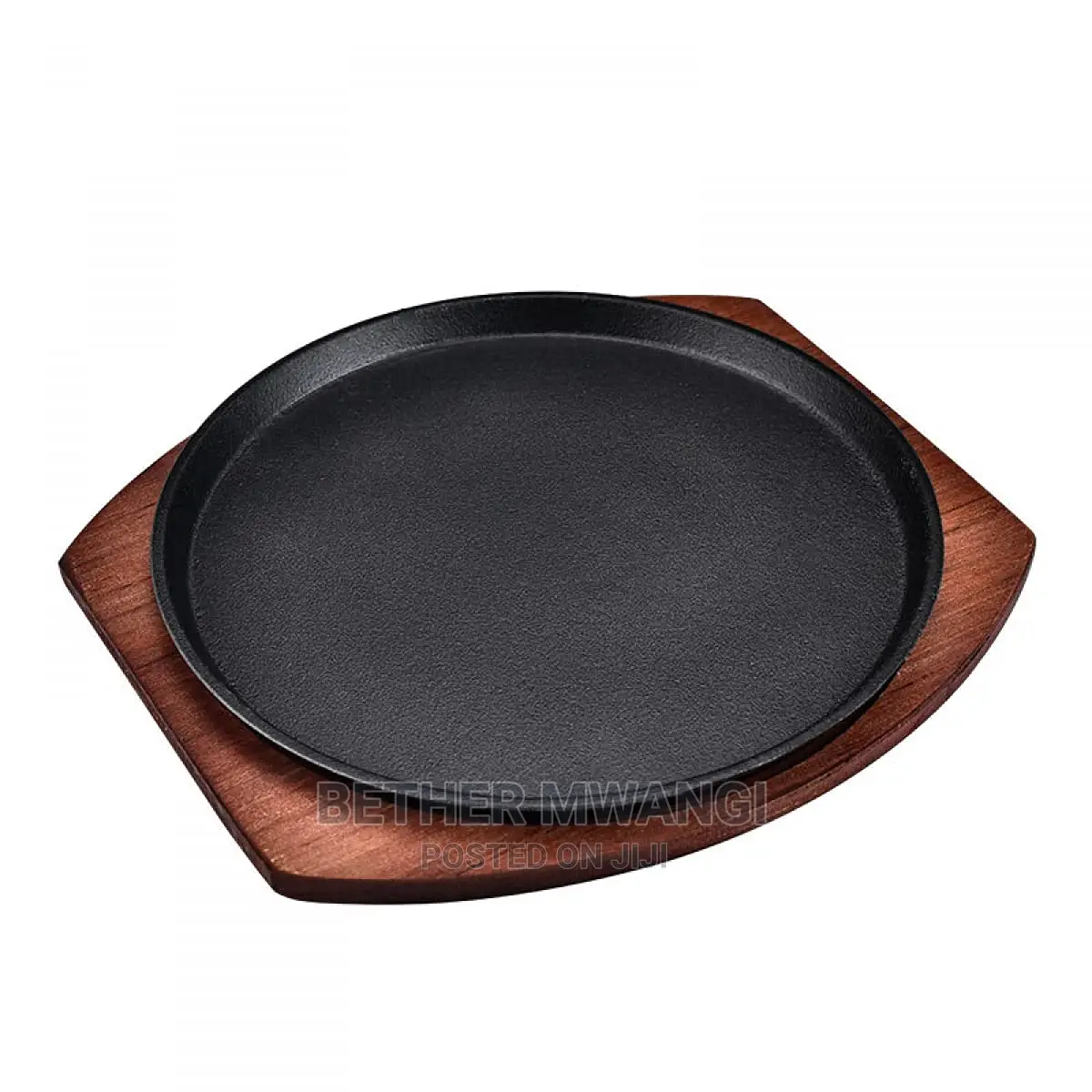 Cast-Iron Hot Sizzling Plate on Wooden Tray
